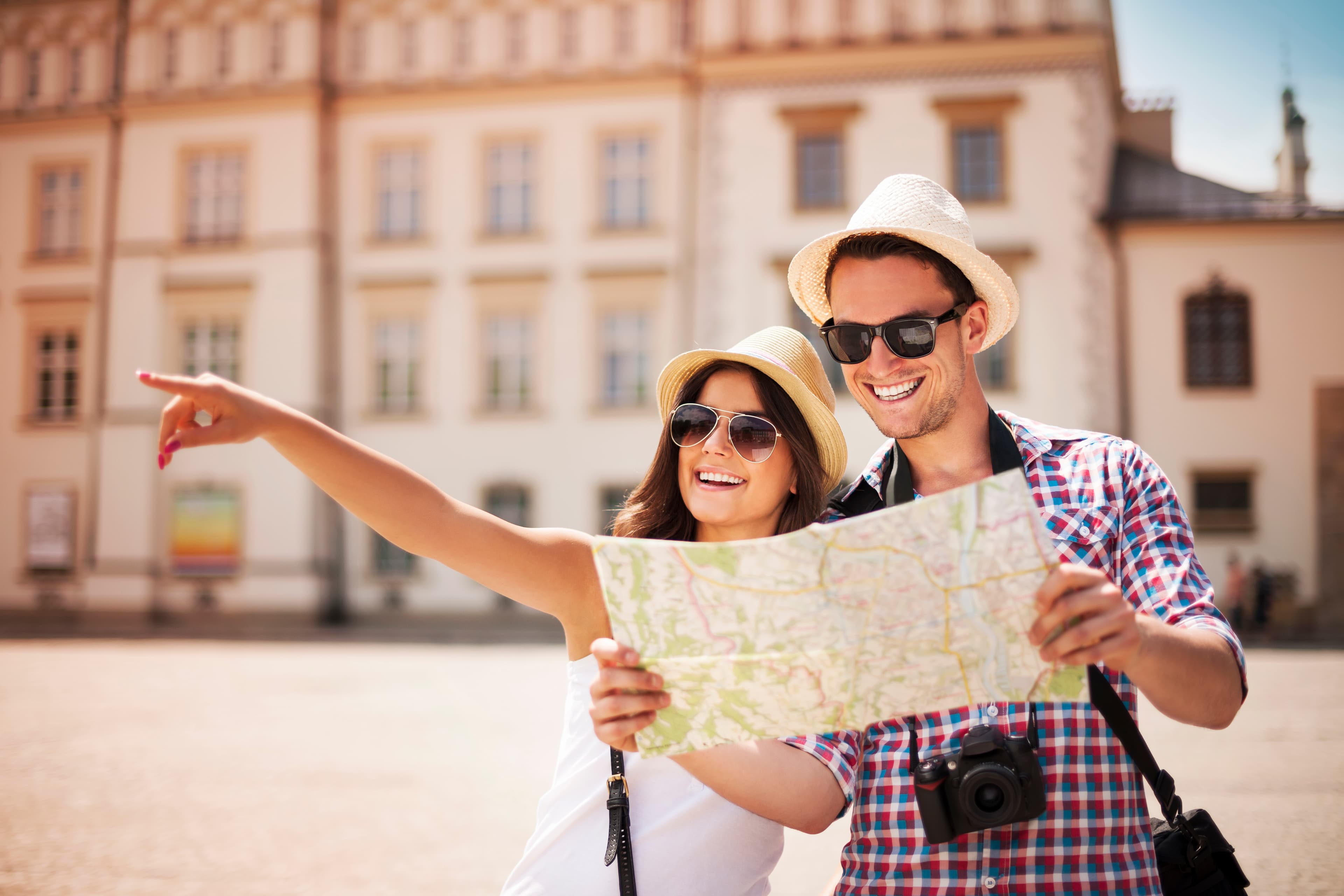 Happy tourist exploring a European city with a map